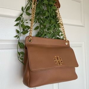 Medium sized, light brown, chain cross body/ Tory burch hand bag